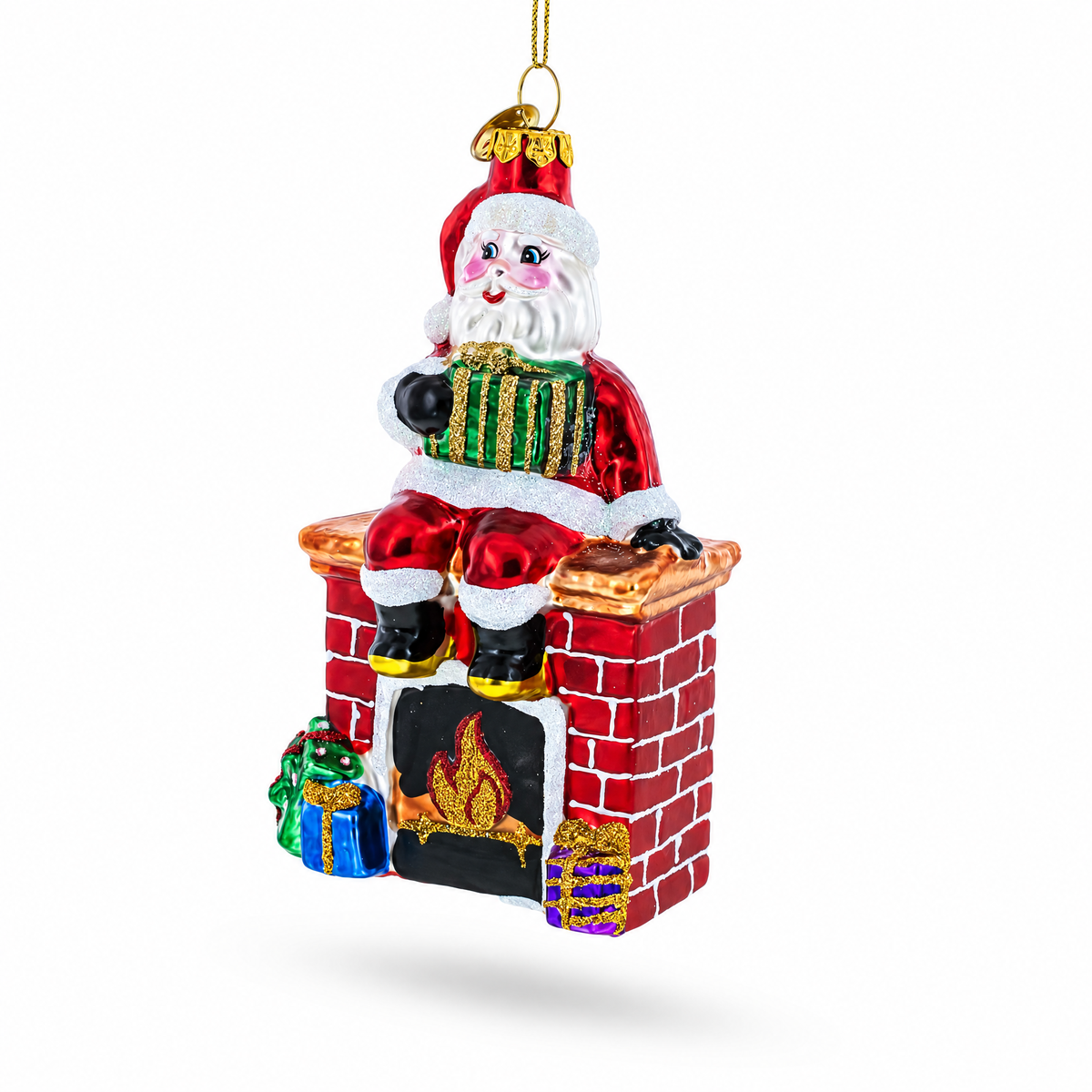 Red glass Santa ornament sitting on a brick fireplace with an accordion.