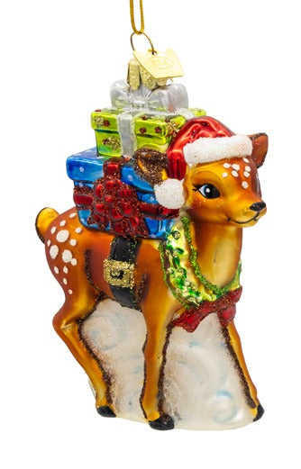 Brown glass fawn ornament wearing a Santa hat and carrying a stack of gifts.