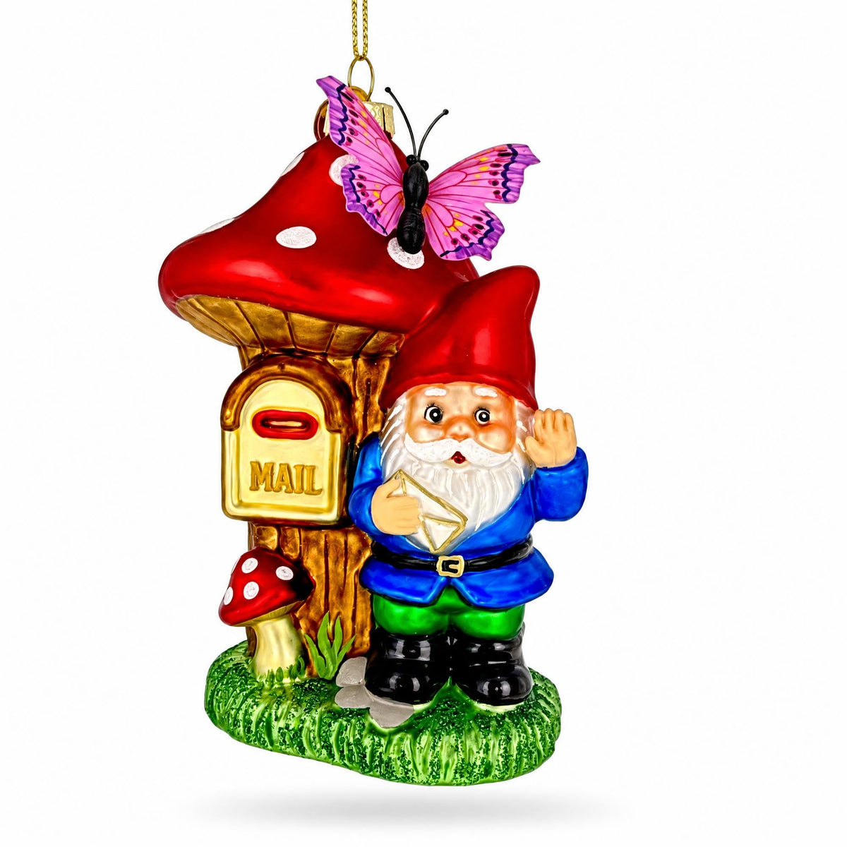 Red glass gnome ornament beside a mushroom mailbox with a butterfly on top.