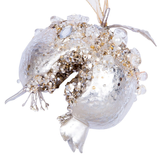 Platinum bejeweled pomegranate ornament with a jeweled surface.