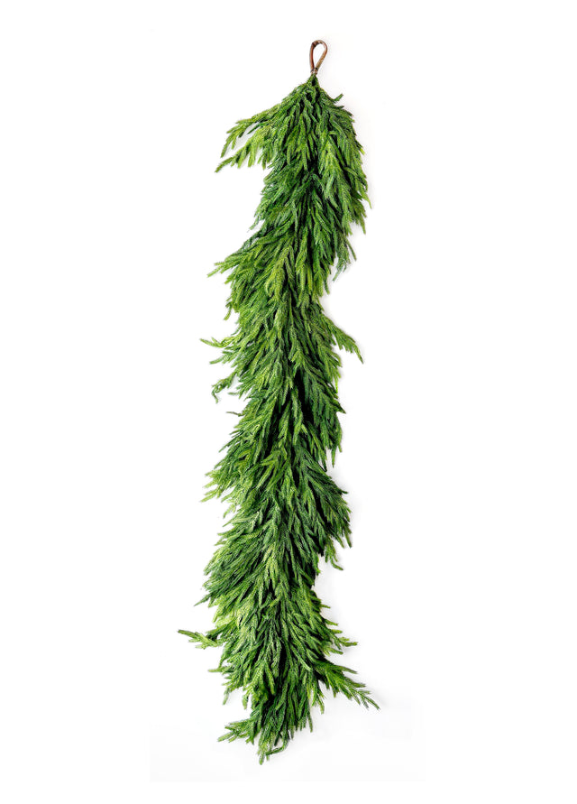 Natural touch Norfolk pine garland in a styled display.
