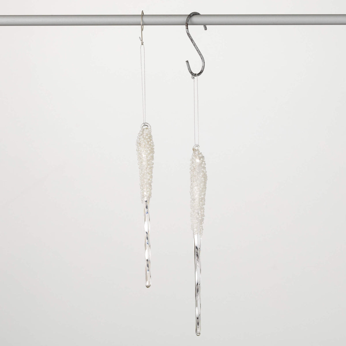 Pearl frosted icicle ornament with tapering icicle forms with a frosted pearl finish.